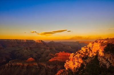 Scenic view of landscape against sky during sunset