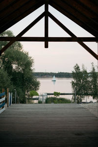 Pier over river against sky