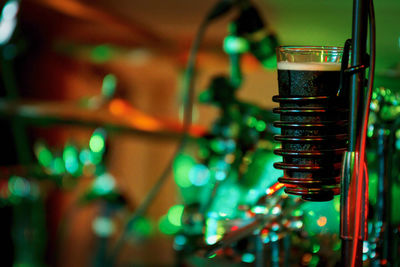 Close-up of beer glass on stand