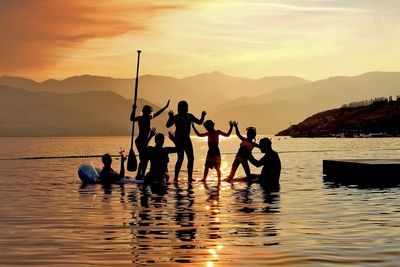 Scenic view of lake at sunset