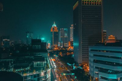 Illuminated buildings in city at night