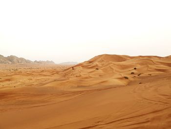 Scenic view of desert against clear sky