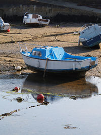 High angle view of boats moored on shore