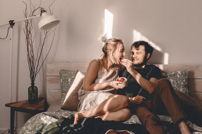 Young couple sitting at home