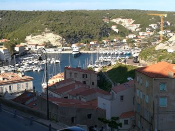 High angle view of townscape by sea