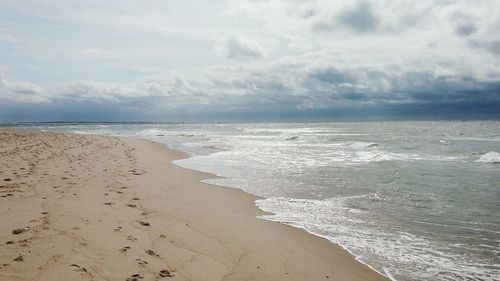 Scenic view of beach against sky