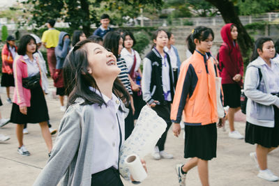 Group of people enjoying in city