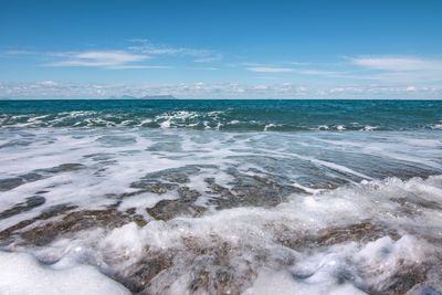 Scenic view of sea against blue sky