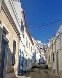 Panoramic view of residential buildings against clear blue sky