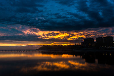 Reflection of clouds in city during sunset