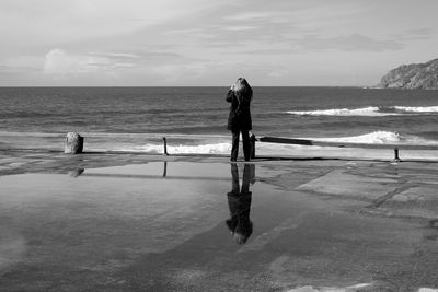 Woman standing on beach