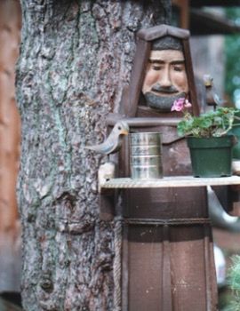 WOMAN IN TREE TRUNK