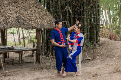 Young couple standing in a forest