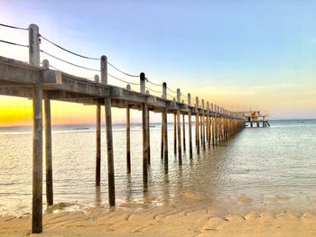 Pier over sea against sky