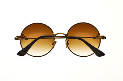 Close-up of sunglasses against white background