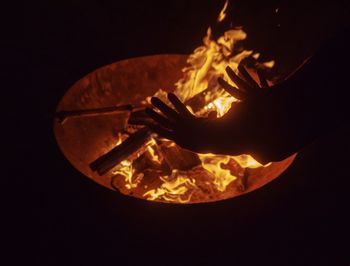 Close-up of fire burning against black background