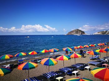 Scenic view of beach against blue sky