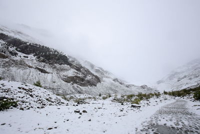 Scenic view of mountains against sky during winter