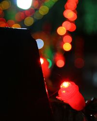 Defocused image of illuminated christmas tree at night