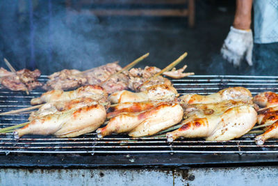 Close-up of meat on barbecue grill