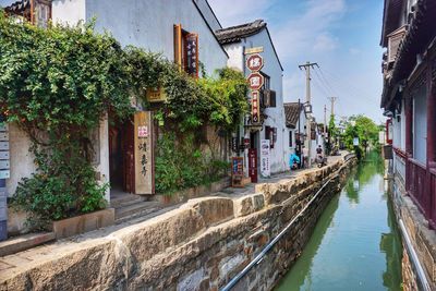 Canal amidst buildings in city