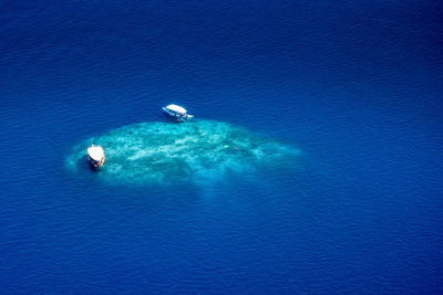 Scenic view of sea against blue sky