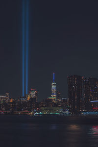 Illuminated buildings in city at night