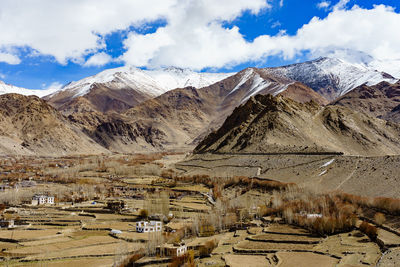 Scenic view of snowcapped mountains against sky