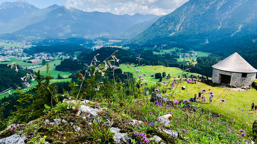 Scenic view of green and mountains against sky