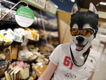 Portrait of man standing at store