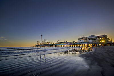 Scenic view of pleasure pier against sky during sunset