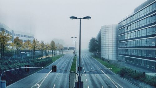 Road in city against sky