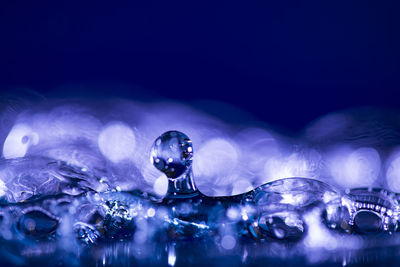 Close-up of water over blue background