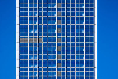 Low angle view of building against blue sky