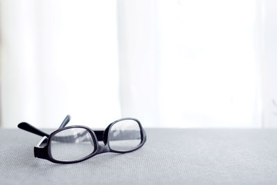 Close-up of eyeglasses on table