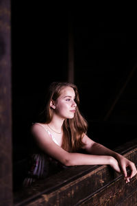 Portrait of beautiful young woman looking away