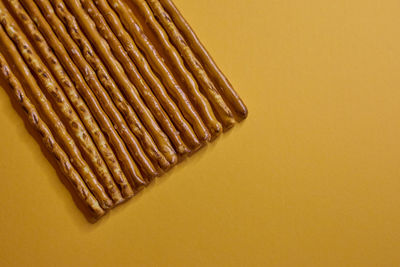 Directly above shot of metal on yellow background