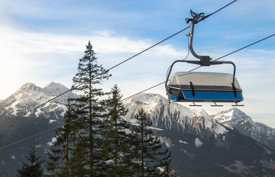 View of overhead cable car against mountain range