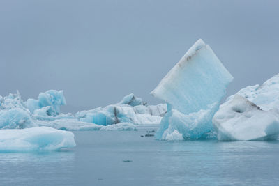 Floating icebergs in jokulsarlon glacial lagoon, iceland. global warming