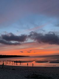 Scenic view of beach against sky during sunset