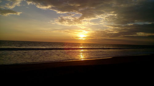 Scenic view of sea at sunset