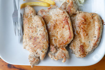 High angle view of meat in plate on table