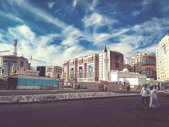 View of buildings in city against sky