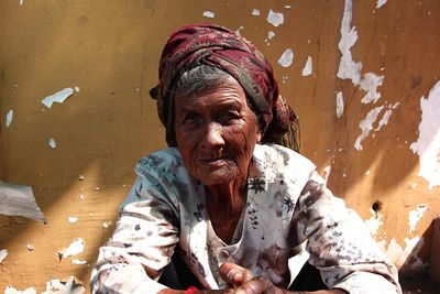 Portrait of woman sitting outdoors