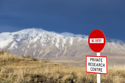 No entry traffic sign with mountain in the background