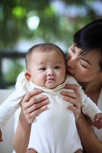 Portrait of mother and baby