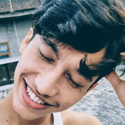 Close-up of smiling young man outdoors