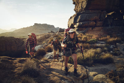 Happy woman hiking with friends on cederberg mountain