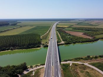 Scenic view of agricultural field against clear sky