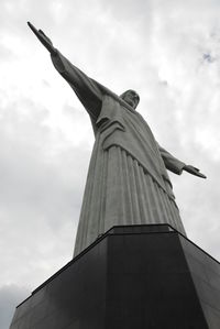 Low angle view of building against cloudy sky